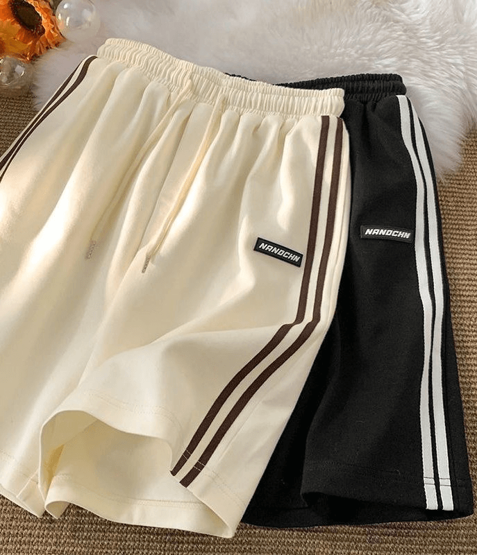 Wide sport casual women's shorts in beige and black with elastic waistband, perfect for active wear. Style SF0195.